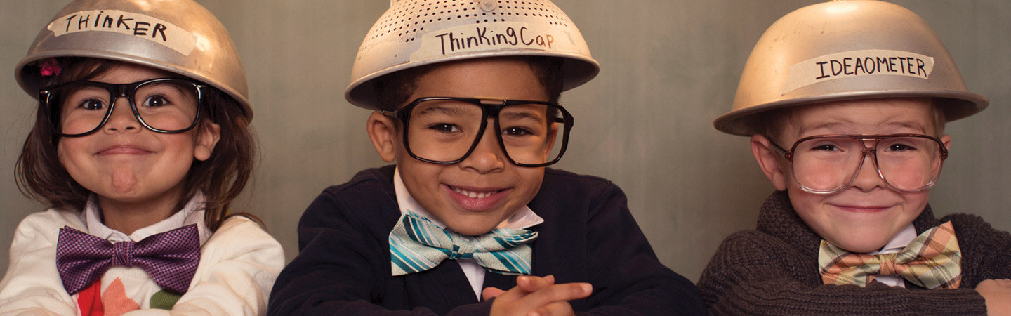 Three children with thinking hats on