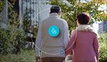 Two older adults walking