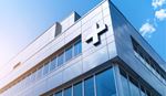 Office building with plus sign